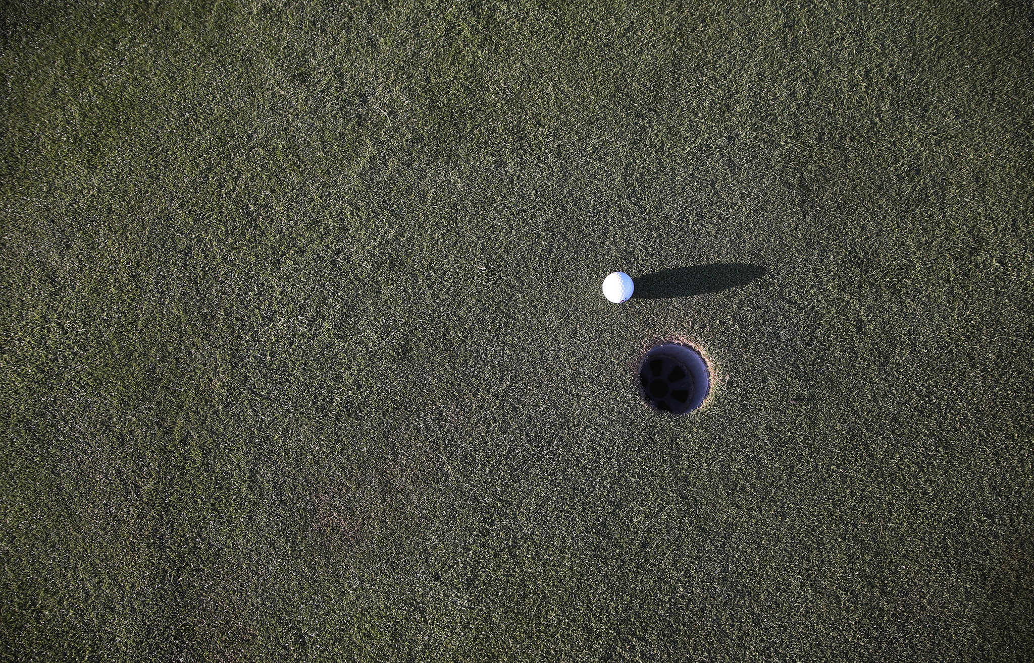 Golf ball near hole 